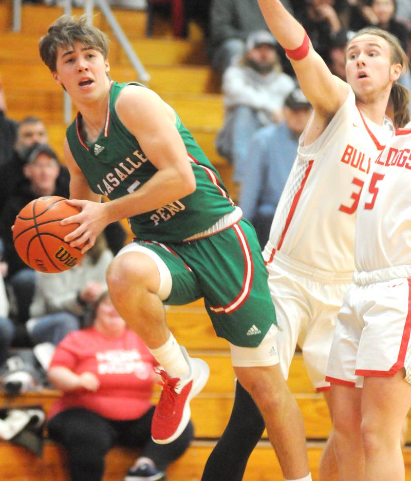 Streator's Logan Aukland dribbles past La Salle-Peru's Cordell Wheatley at Pops Dale Gymnasium on Friday, Jan. 26, 2024.