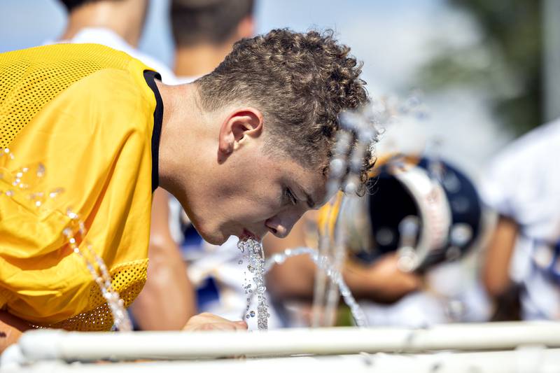 Sterling players cool off with a drink Monday, August 11, 2025, for the first day of football practice.
