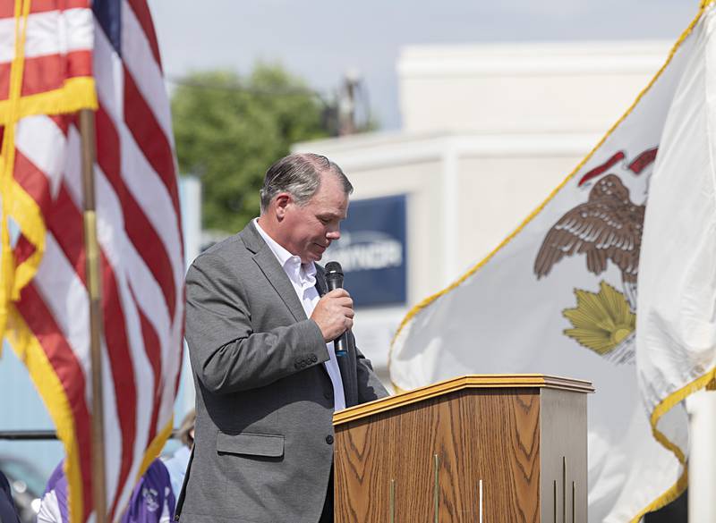 Mark Dallas speaks about the day he stopped a school shooter at Dixon High School during a ceremony at the school on Tuesday, May 30, 2023.