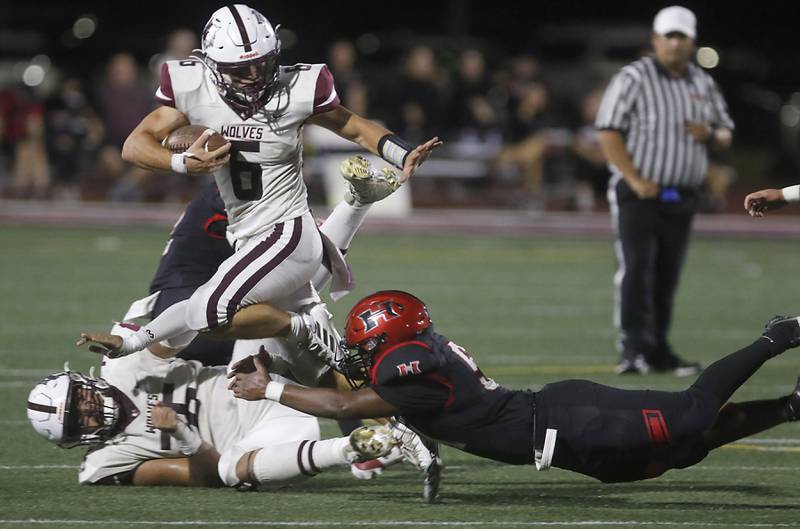 Prairie Ridge's Luke Vanderwiel runs out of the tack attempt of Huntley's Jonas Owens during a Fox Valley Conference football game on Friday, Sept. 20, 2024, at Huntley High School.