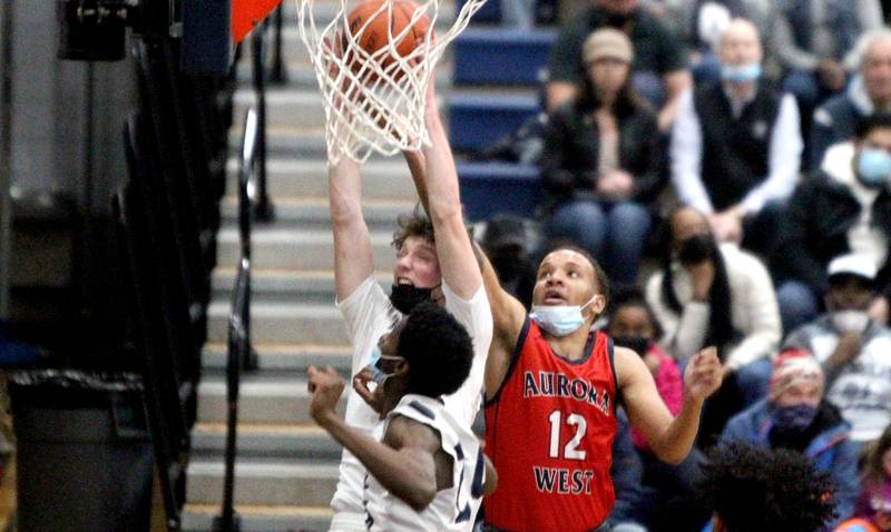 West Aurora’s Kenyon Weekley (12) goes up for a shot during a game at Oswego East on Friday, Jan. 28, 2022.