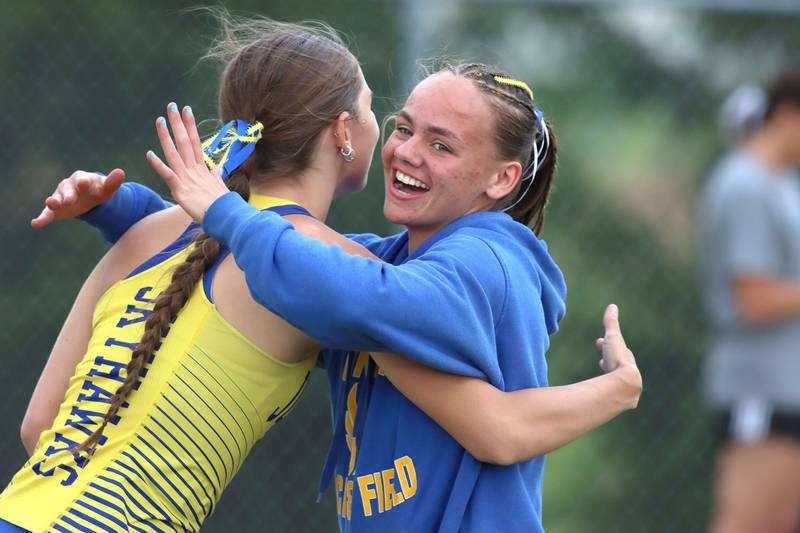 Johnsburg’s Carly Duck, left, is greeted by teammate Hope Klosowicz after Duck’s pole vault in IHSA Class 2A Girls Sectional Track action at Genoa-Kingston School in Genoa on Friday, May 16, 2025.