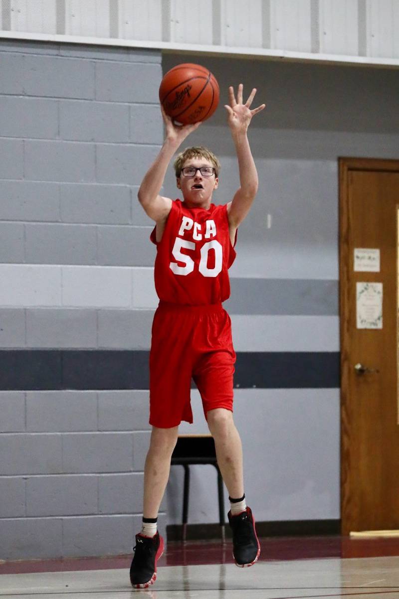Princeton Christian Academy's Trustin Crew shoots a 3-pointer against Fulton Unity Christian Thursday night at PCA's Howard Hoffman Gym. PCA won 39-35.
