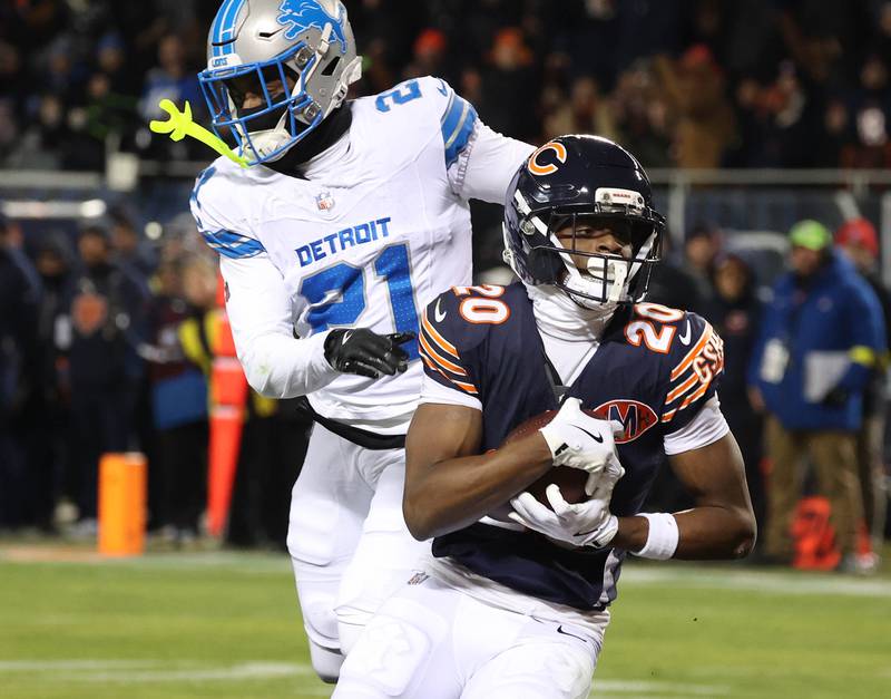 Chicago Bears wide receiver Jahdae Walker catches a touchdown pass in front of Detroit Lions cornerback Amik Robertson during their game Sunday, Jan. 4, 2026, at Soldier Field in Chicago.