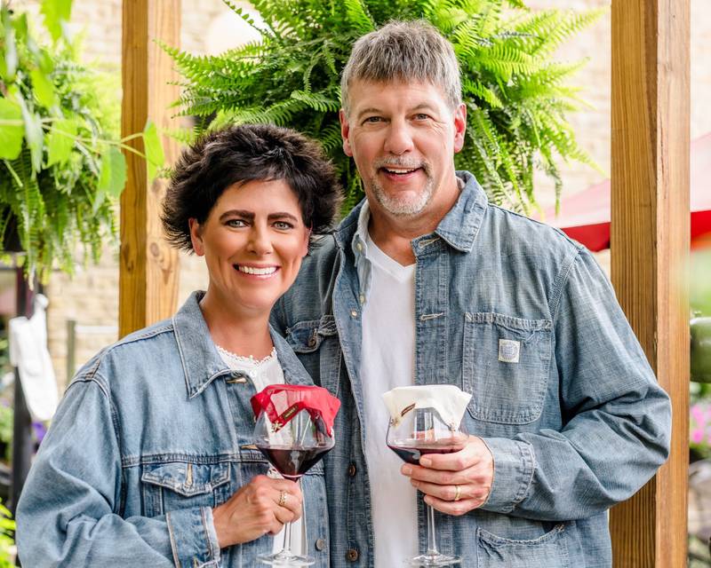 Linda and Mark Hirth of Campton Hills with their wineVEIL product covering their wine glasses – so bugs don’t get in while sitting outside.