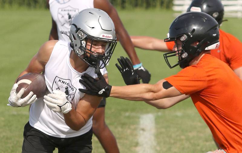 Kaneland and DeKalb players compete during 7-on-7 drills Tuesday, July 26, 2022, at Kaneland High School in Maple Park.