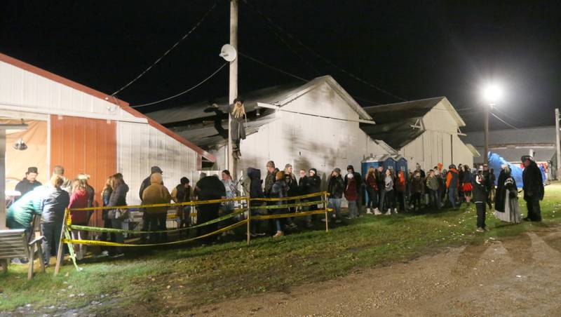 A long line of visitors wait to enter the Nightmare Haunted Attraction on Saturday, Oct. 14, 2023 at the Bureau County Fairgrounds in Princeton.