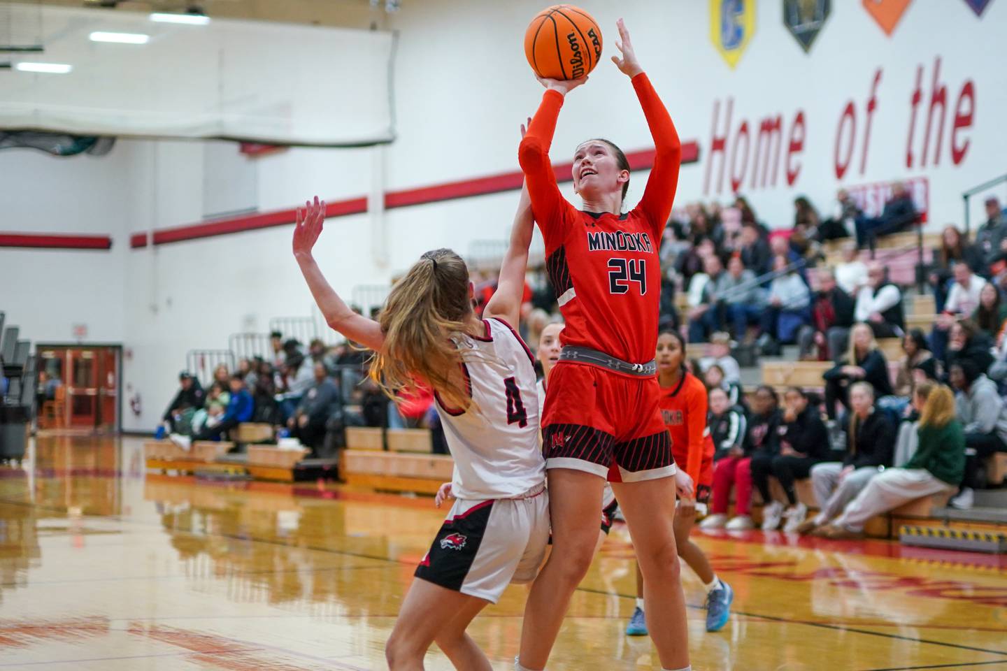 Minooka’s Madelyn Kiper (24) shoots the ball in the post over Yorkville's Macie Jones (4) during a basketball game at Yorkville High School on Thursday, Dec. 5, 2024.
