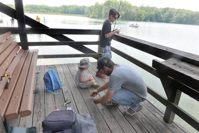 The Zemke family from Rock Falls spent a portion of Sunday fishing in Lake Carlton at the Morrison-Rockwood State Park. Pictured are Johnna, 4, Kole, 10, and their dad John. Their mom, Paige, was busy keeping their dog occupied.