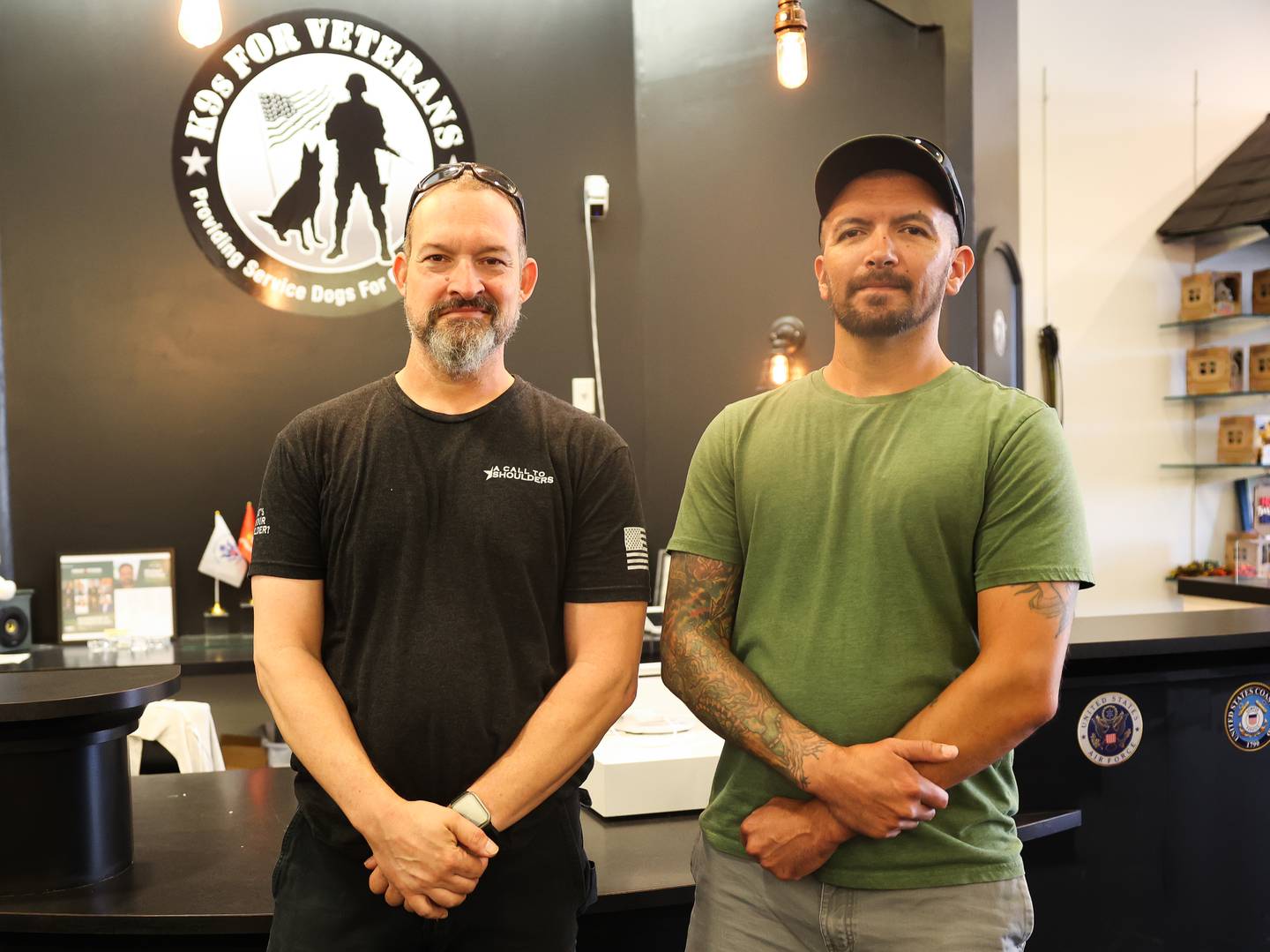 Samson Garcia, a disabled Army veteran, left, owner of Samson Wood Services, poses with Greg Zilioli, who helped Samson start his business, at K9s For Veterans Outlet Store where he sells some of his work in Bolingbrook, Thursday, July 25, 2024.