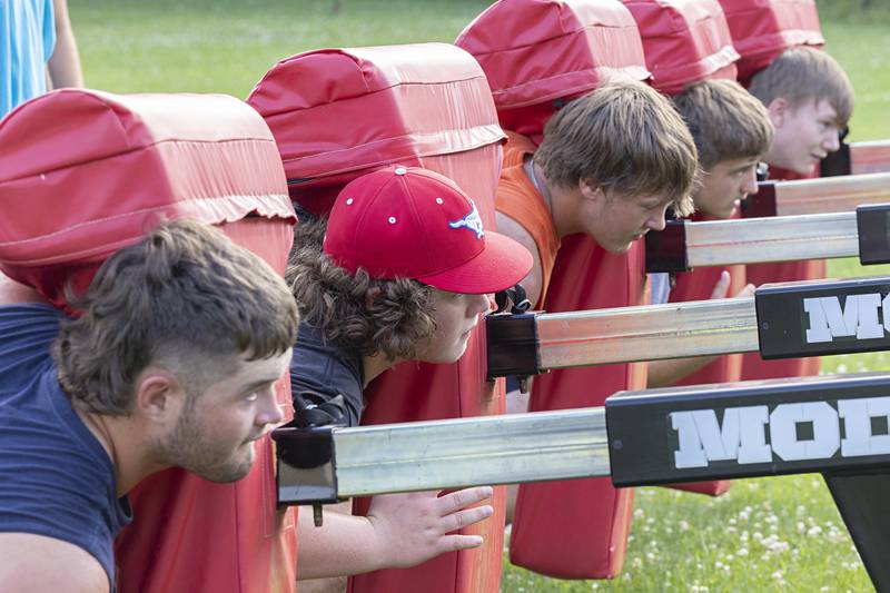 The Morrison football team goes through workouts during a camp Tuesday, July 25, 2023. The Mustangs will open their season against Mendota at the end of August.