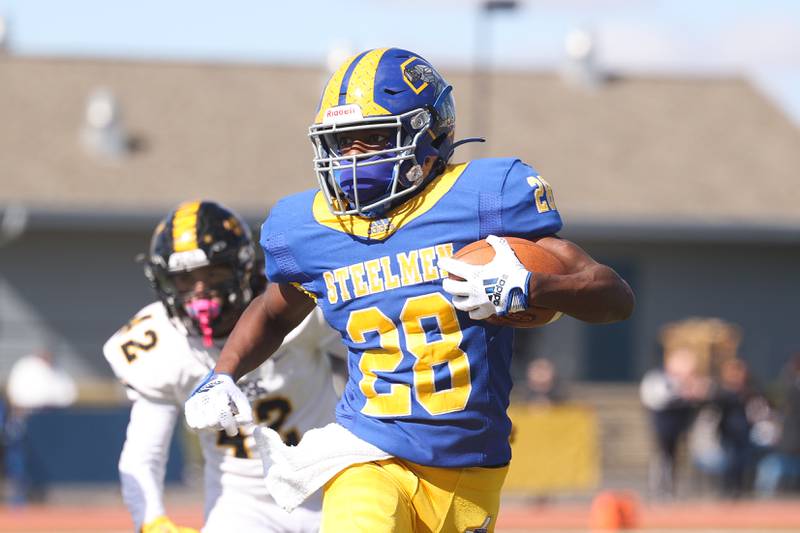 Joliet Central’s Marcus Hill rushes against Joliet West on Saturday.