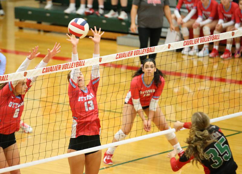 Ottawa's Ayla Dorsey blocks a spike from L-P's Aubrey Duttlinger on Tuesday, Oct. 17, 2023 at Sellett Gymnasium.