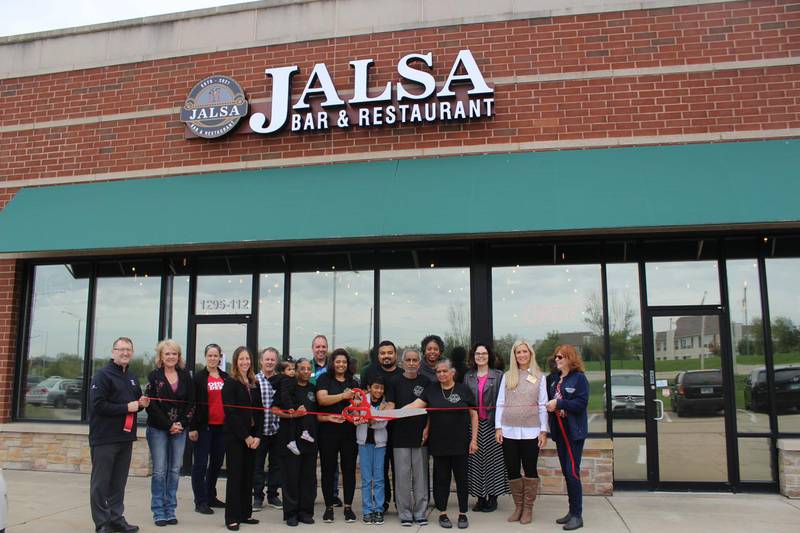Nikunj and Dhara Patel, owners of Jalsa Bar and Restaurant, along with their family, friends, and the staff and board members of the Cary-Grove Area Chamber of Commerce and the Crystal Lake Chamber of Commerce, celebrate a grand opening with a ribbon cutting on Friday, Oct. 15, 2021.