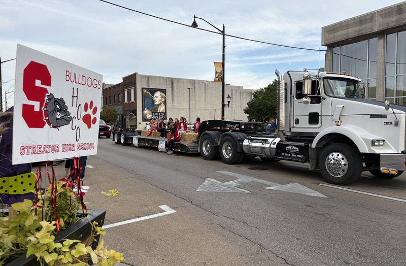 The Streator High School girls tennis team rides on the back of a decorated semi-truck during the school’s homecoming parade Wednesday, Oct. 1, 2025, in downtown Streator.
