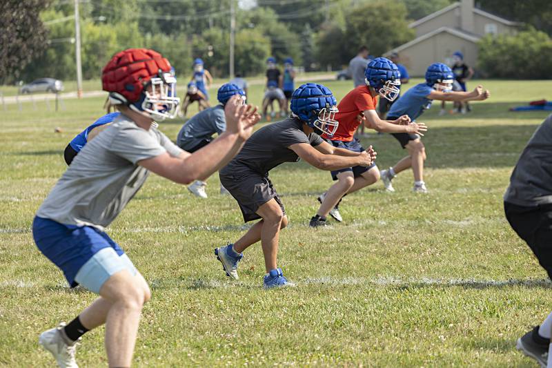 Newman players run through drills during first day of football practice Monday, August 7, 2023.