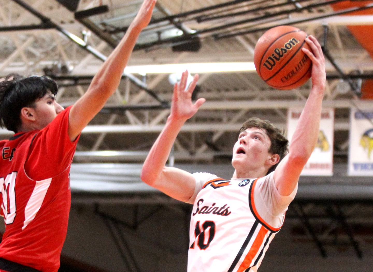 St. Charles East’s Steven Call (10) puts the ball up during a game against East Aurora in the 63rd Annual Ron Johnson Thanksgiving Tournament at St. Charles East on Monday, Nov. 21, 2022.