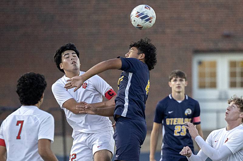 Lasalle-Peru’s Antonio Martinez (left) and Sterling’s Anthony Rosas work for the ball Tuesday, Oct. 17, 2023 in a regional semifinal in Sterling.