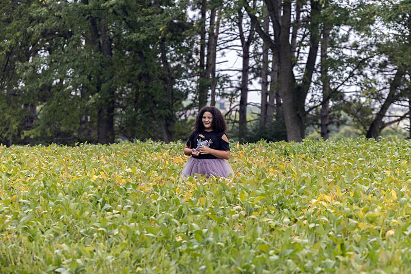 Penelope Williams waits in a soybean field for runners to pass Saturday, Sept. 16, 2023.