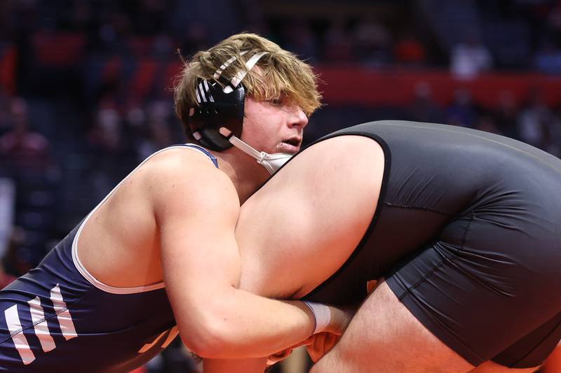 Nazareth’s Gabe Kaminski works over Reed-Custer’s Kody Marschner in the Class 1A 220lb. semifinals at State Farm Center in Champaign. Friday, Feb. 18, 2022, in Champaign.