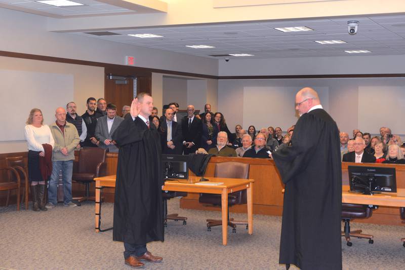 Ogle County Judge John "Ben" Roe (left) addresses the crowd before swearing in Russell Crull as the new associate judge for the 15th Judicial Circuit on Thursday, Nov. 21, 2024. Roe administered the oath of office in Courtroom 202 at the Ogle County Judicial Center in Oregon.