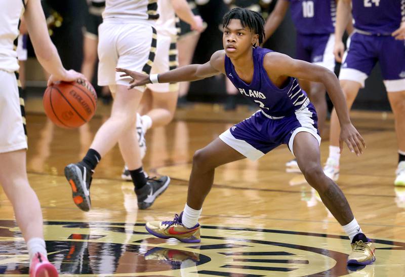 Plano's AJ Johnson plays defense against Sycamore's Aidan Wyzard Tuesday, Jan. 3, 2023, during their game at Sycamore High School.