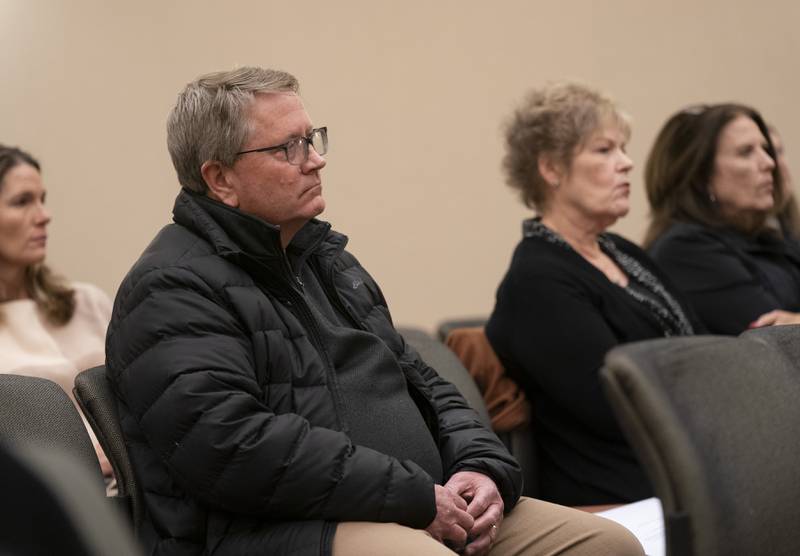 Incumbent City Council member Brett Hopkins listens during a hearing of the Crystal Lake Municipal Officers Electoral Board for hearing and passing upon of objections to nomination papers for candidates for Mayor and City Council at City Hall on Thursday, December 15, 2022. Ryan Rayburn for Shaw Local