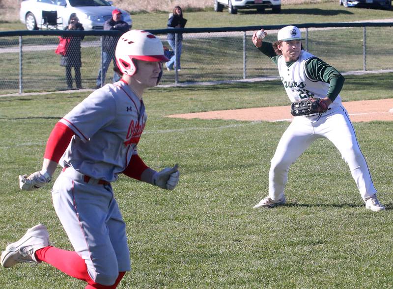 St. Bede's Alan Spencer throws to first base to force out Ottawa's Jace Veith on Wednesday, March 20, 2024 at St. Bede Academy.