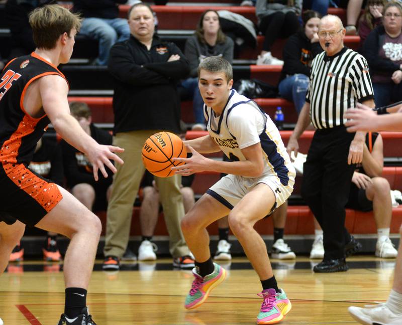 Polo's Mercer Mumford (4) looks to pass during action against Warren on Tuesday, Dec. 17, 2024 at the 63rd Annual Forreston Holiday Tournament.