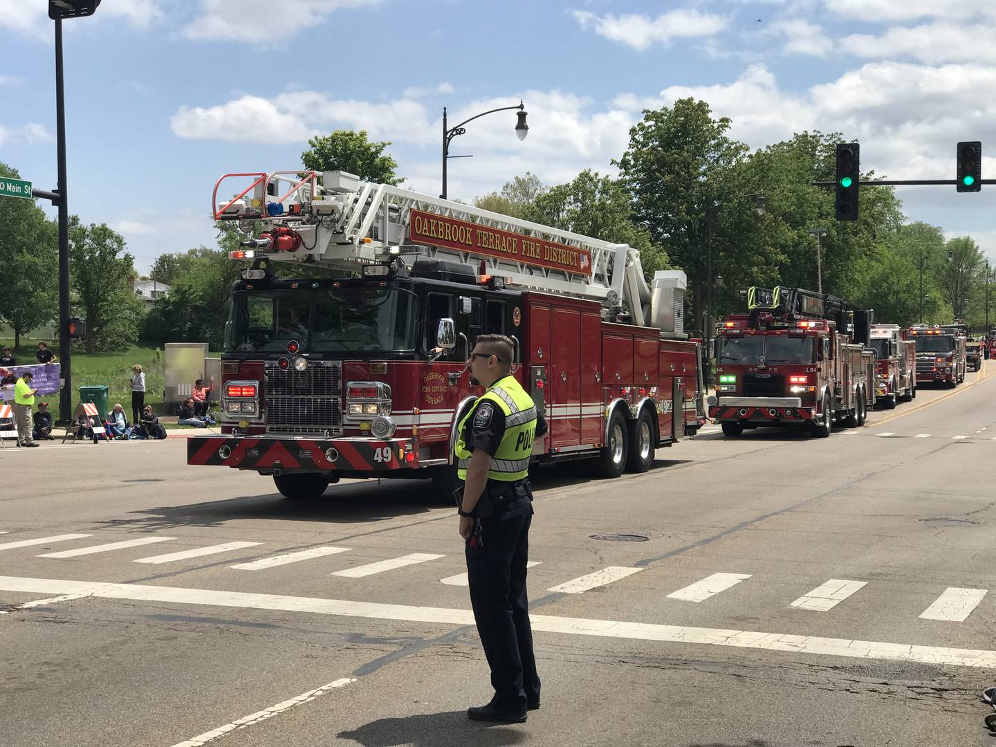 A procession of fire vehicles kicks off the Lombard Lilac Festival parade.