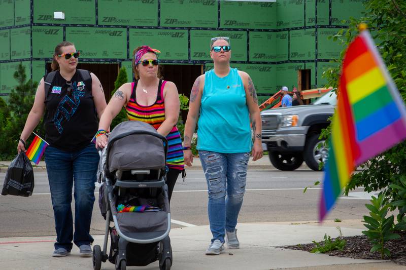 Parade goers walk into Ottawa Family Pride Fest on Saturday, June 8, 2024 at Jordan Block Park in Ottawa.