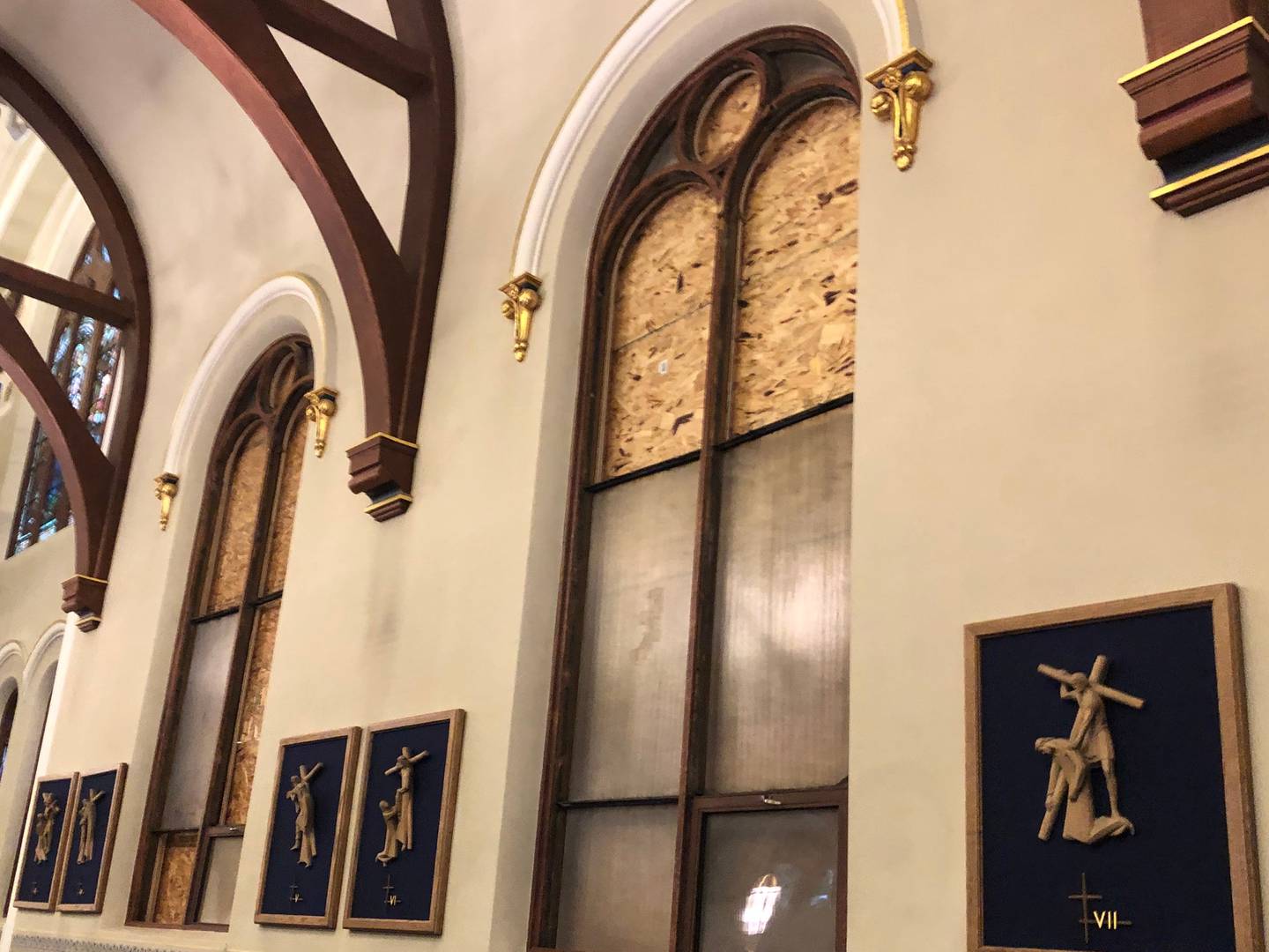 Stained glass windows at St. Mary Church in Woodstock boarded up following an Oct. 9 home explosion.