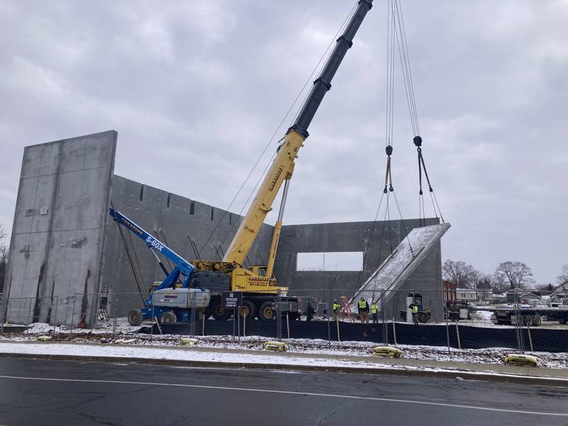 A crane hoists a piece of wall piece off a truck for the new Gompers Junior High School gym at 1501 Copperfield Ave. in Joliet on Thursday Jan. 23, 2025.