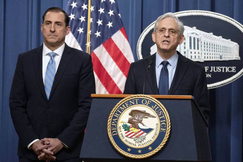 Attorney General Merrick Garland speaks during a news conference at the Department of Justice, Thursday, Jan. 12, 2023, in Washington, as John Lausch, the U.S. Attorney in Chicago, looks on. Robert Hur, the former Trump-appointed U.S. attorney in Maryland, will lead the investigation, taking over from the top Justice Department prosecutor in Chicago, John Lausch, who was earlier assigned by the department to investigate the matter and who recommended to Garland last week that a special counsel be appointed. Hur is to begin his work soon. (AP Photo/Manuel Balce Ceneta)