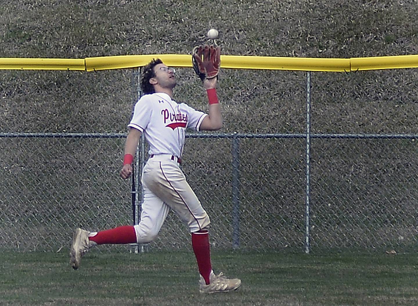 Ottawa center fielder Julian Alexander chases down a fly ball in the 1st inning against Streator Thursday at Ottawa.