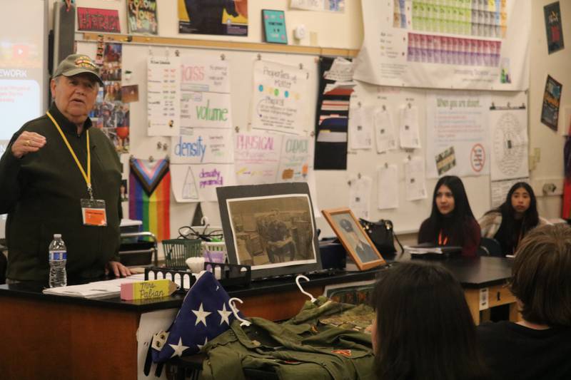 Edward Higgins, a Vietnam War veteran from Rockford, talks Monday, Nov. 10, 2025, to students at Clinton Rosette Middle School in DeKalb.