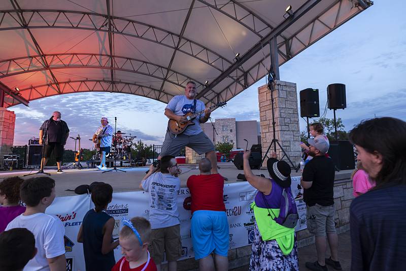 3 Day Rain entertains the crowd Wednesday, July 3, 2024 as a lead in to the fireworks show in Rock Falls. Lots of food vendors were also on hand to provide the grub.