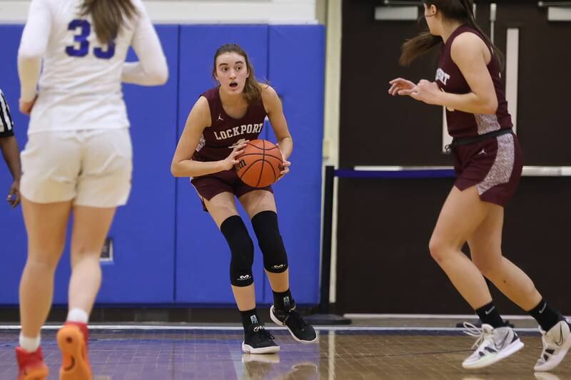 Lockport’s Alaina Peetz looks to pass off the ball against Lincoln-Way East in the Class 4A Lincoln-Way East Regional semifinal. Monday, Feb. 14, 2022, in Frankfort.