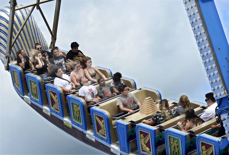 Riders zoom through the sky as they ride Pharaoh’s Fury during the opening night of the Streator Fest carnival Thursday, Aug. 9, 2023, at Northpoint Plaza.