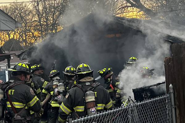 Crews battle Joliet garage fire