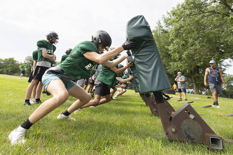 Rock Falls footballers run through drills Tuesday, July 16, 2024, at the high school’s sports campus. Football in the state will start official practice in about a month.