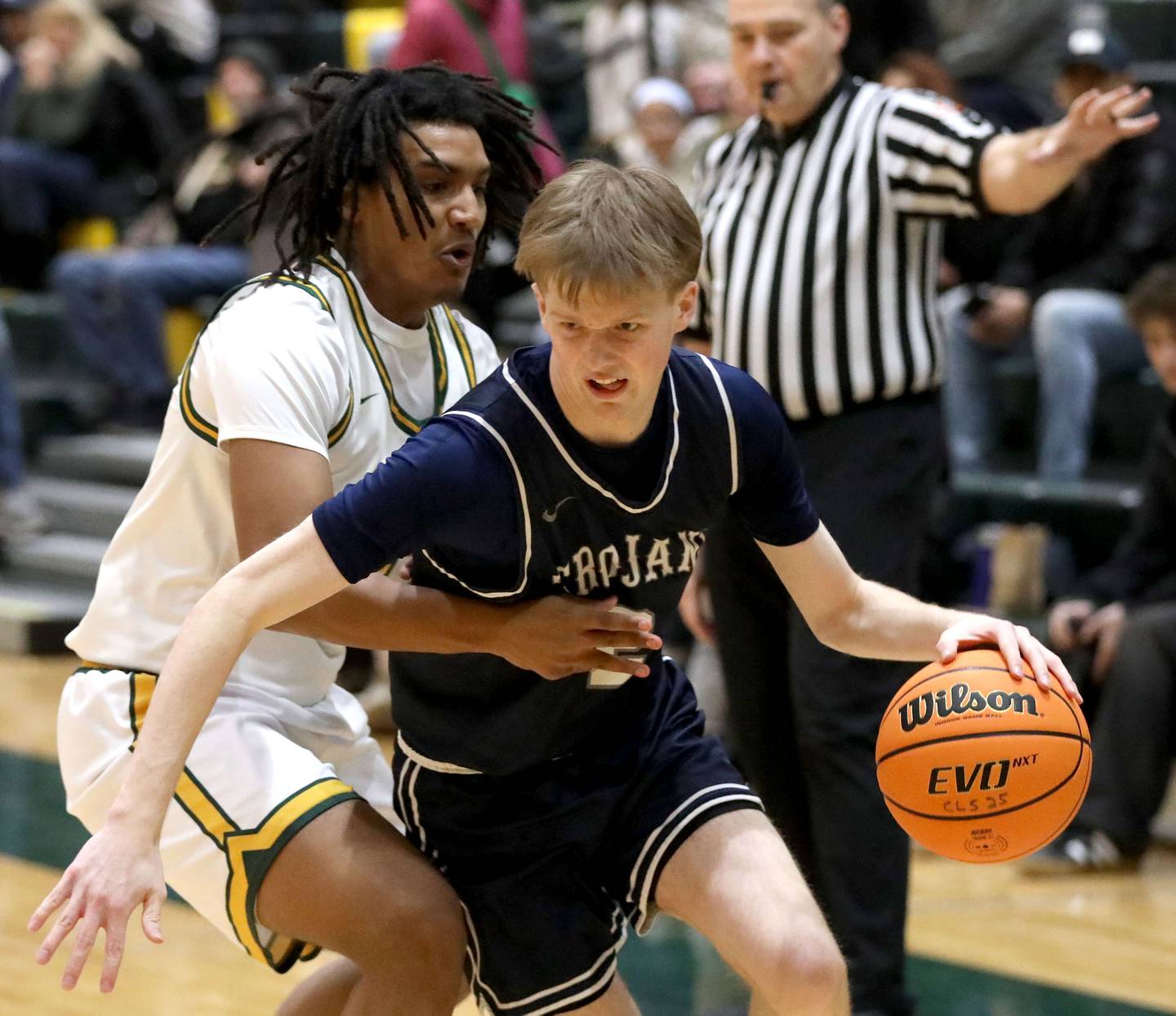 Cary-Grove's AJ Berndt (right) tries to drive the baseline against Crystal Lake South's David Mcfadden during a Fox Valley Conference boys basketball game on Friday, Jan. 23, 2026, at Crystal Lake South High School.