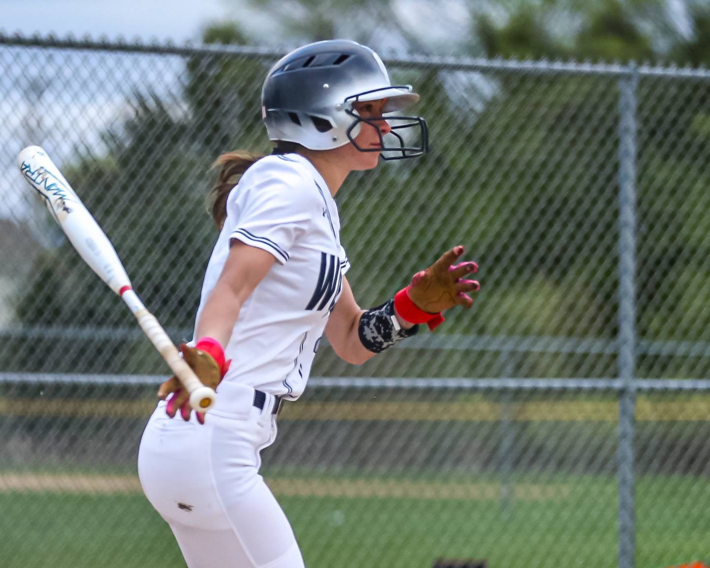 Oswego East's Lundin Cornelius (2) knocks in he winning run during softball game between Yorkville at Oswego East. April 17th, 2024.