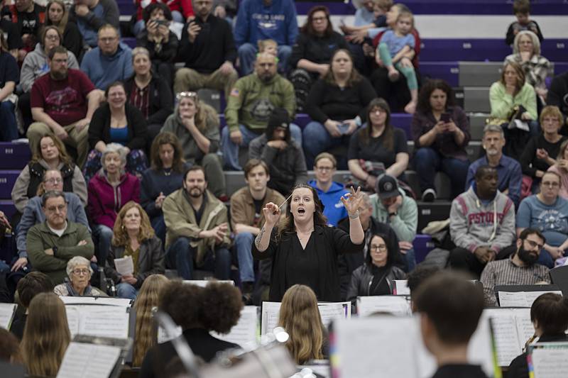 Reagan Middle School seventh and eighth grade band director Ashley Almquist leads her band Friday, Feb. 13, 2026, at the fourth annual Dixon Band Festival.
