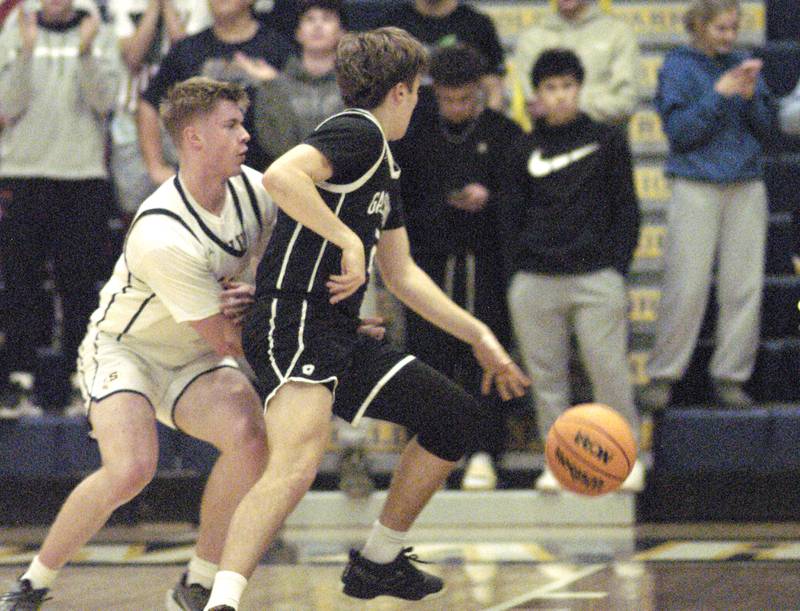 Sterling's Wii Ports tries to get the ball from Galesburg's Jackson Crocksibbing. Sterling Boys Basketball hosted Galesburg at Musgrove Fieldhouse on February 11, 2025.