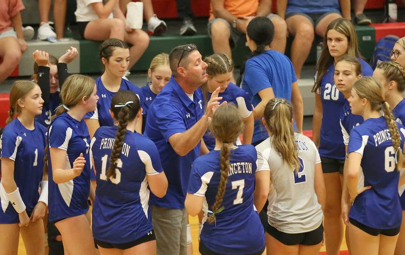 Princeton volleyball head coach Andy Puck talks to his team during a timeout against L-P on Tuesday, Aug. 22, 2023 in Sellett Gymnasium.