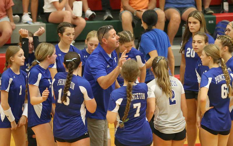 Princeton volleyball head coach Andy Puck talks to his team during a timeout against L-P on Tuesday, Aug. 22, 2023 in Sellett Gymnasium.
