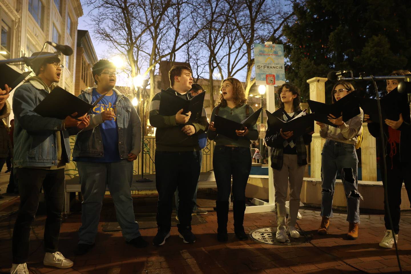 Joliet Central Madrigal Singers perform at the Light Up the Holidays Festival and Parade in downtown Joliet.