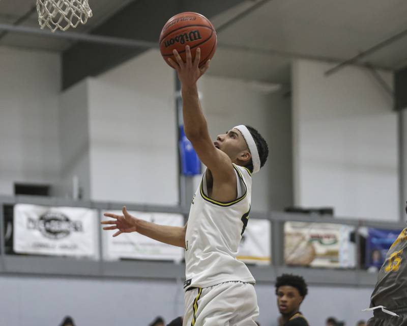 Yorkville Christian's Tray Alford (4) goes in for a layup during their basketball game between Christ the King at Yorkville Christian, Feb 6, 2026 in Yorkville.