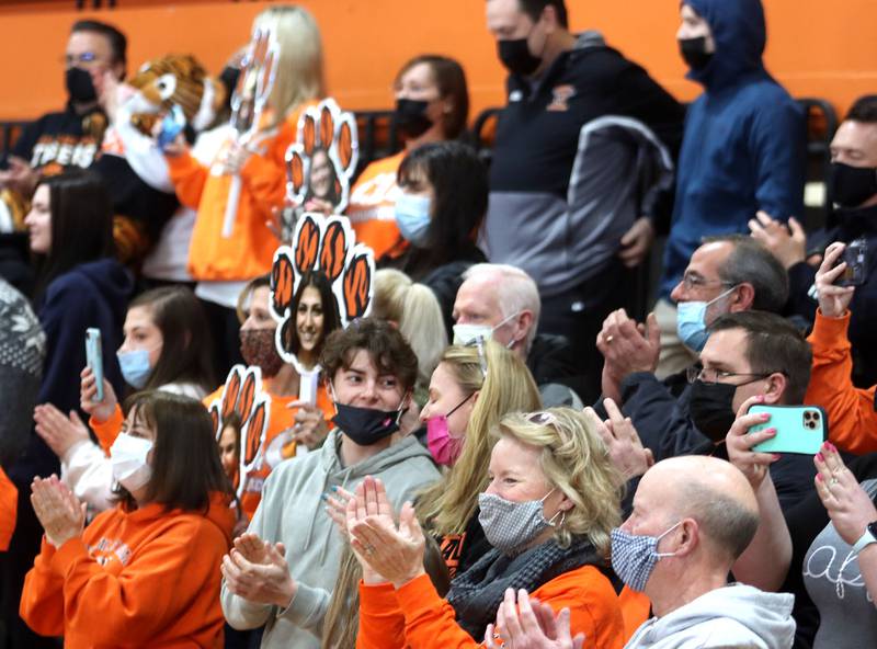 Fans cheer as Crystal Lake Central held a celebration Sunday in their gymnasium after the Tigers on Saturday won the IHSA state title in Competitive Cheerleading-Medium Team at Grossinger Motors Arena in Bloomington.